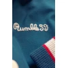 Détail broderie cursive Rumble59 sur veste bowling homme bleu pétrole, finition vintage authentique style années 50