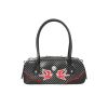 Sac à main rockabilly noir à pois blancs, poche zippée frontale et liseré rouge, anses rigides noires style pin-up années 50