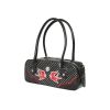 Détail face avant sac bowling noir à pois blancs, liseré rouge et fermeture éclair argentée, style rockabilly vintage